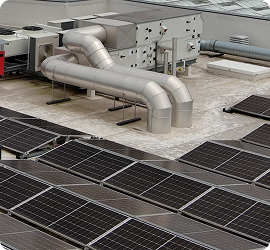 A rooftop equipped with solar panels and industrial ventilation ducts.